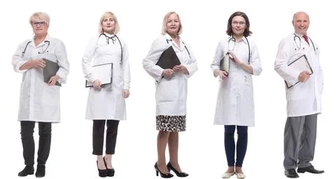 Full length group of doctors with notepad isolated Foto stock