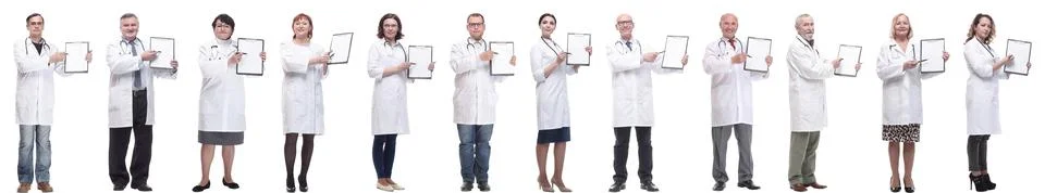 Full length group of doctors with notepad isolated Foto stock