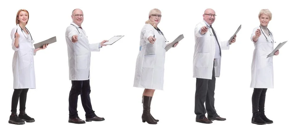 Full length group of doctors with notepad isolated 스톡 사진