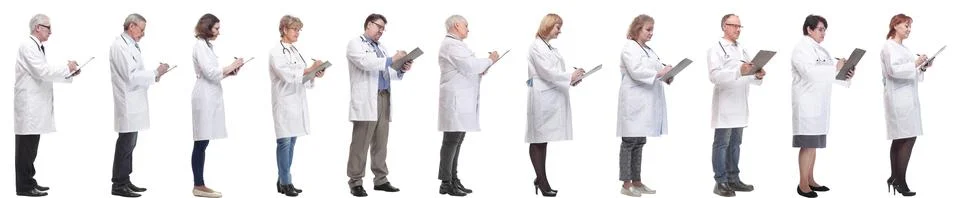 Full length group of doctors with notepad isolated Stock Photos