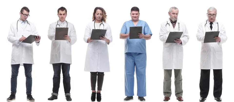 Full length group of doctors with notepad isolated Foto stock