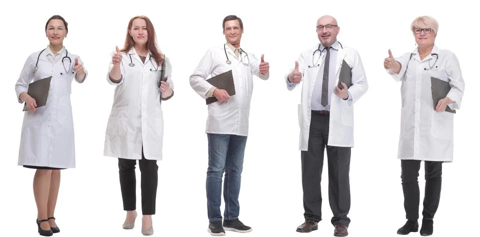Full length group of doctors with notepad isolated Foto stock