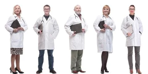 Full length group of doctors with notepad isolated Stock Photos