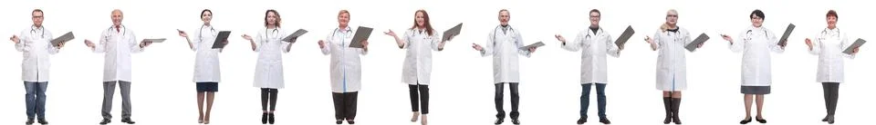Full length group of doctors with notepad isolated 스톡 사진
