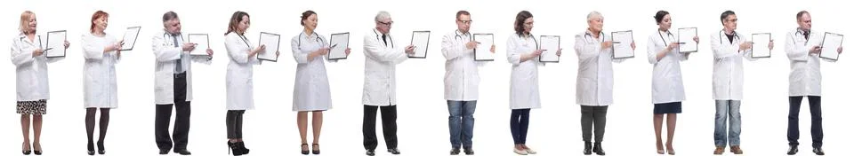 Full length group of doctors with notepad isolated Stock Photos
