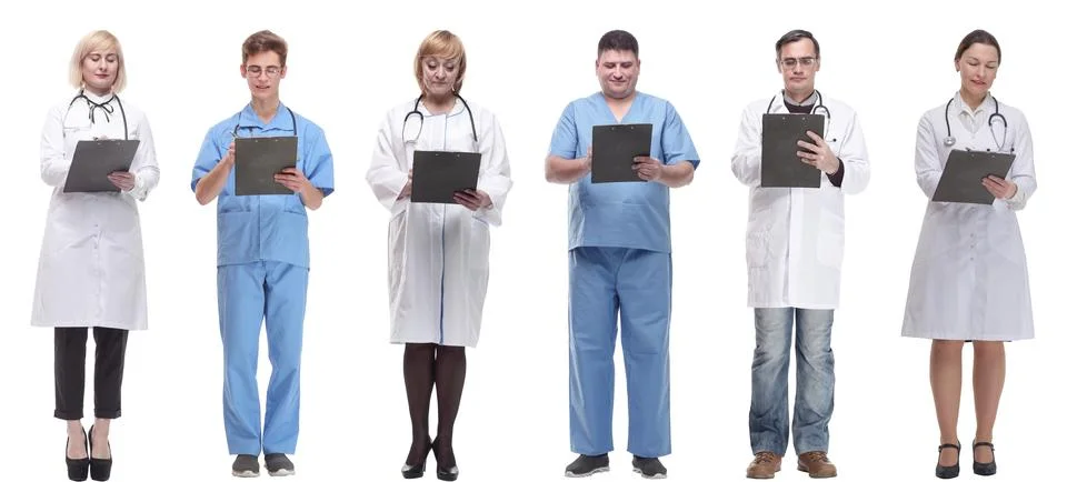Full length group of doctors with notepad isolated Foto stock