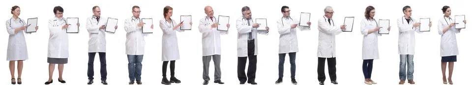 Full length group of doctors with notepad isolated Stock Photos