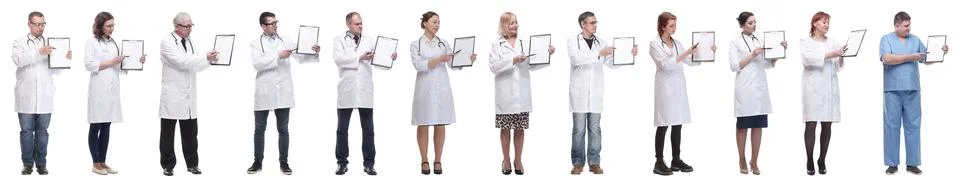 Full length group of doctors with notepad isolated Stock Photos
