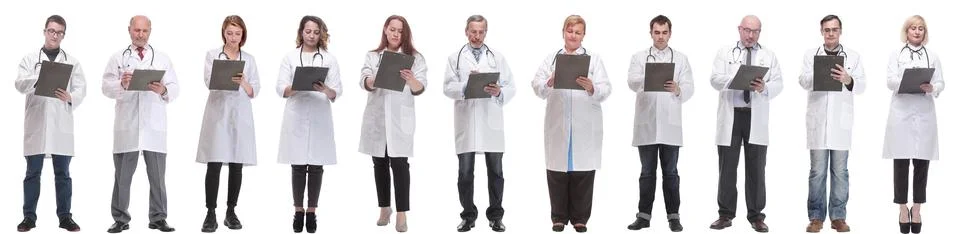 Full length group of doctors with notepad isolated Foto stock