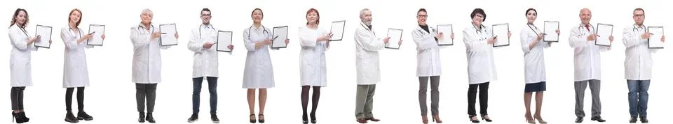 Full length group of doctors with notepad isolated Stock Photos