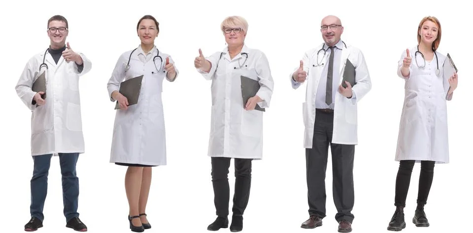 Full length group of doctors with notepad isolated Stock Photos