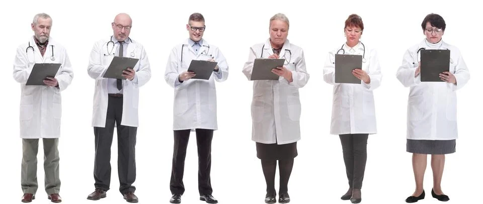 Full length group of doctors with notepad isolated Stock Photos