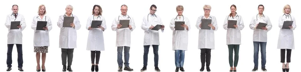 Full length group of doctors with notepad isolated Foto stock