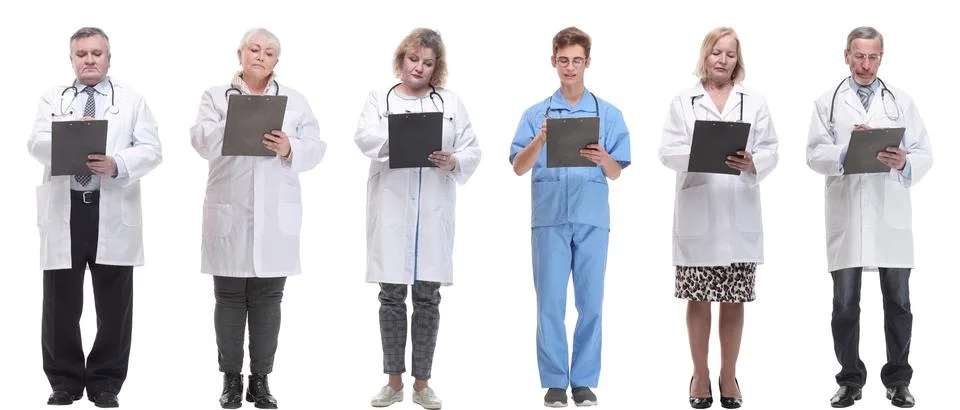 Full length group of doctors with notepad isolated Stock Photos