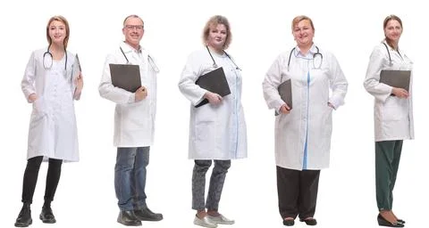 Full length group of doctors with notepad isolated Stock Photos