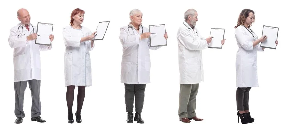 Full length group of doctors with notepad isolated Stock Photos