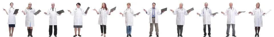 Full length group of doctors with notepad isolated Stock Photos