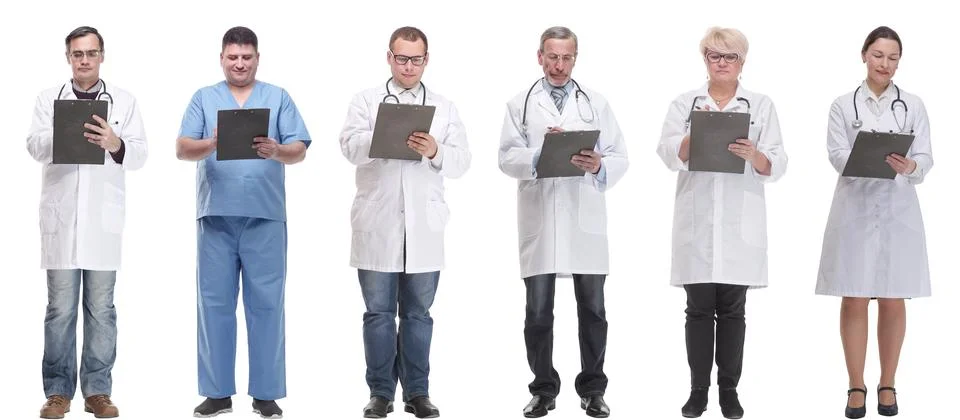 Full length group of doctors with notepad isolated Stock Photos