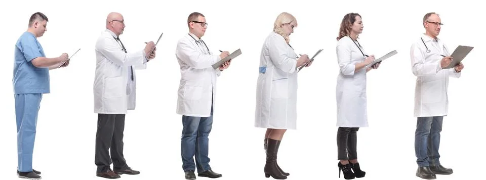 Full length group of doctors with notepad isolated Foto stock