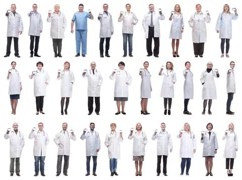 Full length group of doctors showing badge isolated Foto stock
