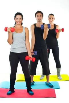 Full length of happy team doing fitness Stock Photos