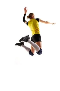 Full-length image of young athletic woman, volleyball player in motion, playing Stock Photos