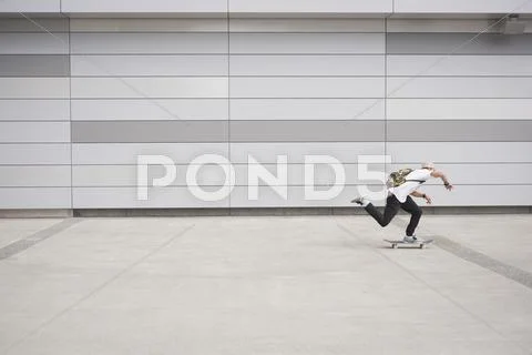 Full length of man skateboarding outdoors Stock Photos