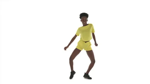 Full length portrait of African dancing woman in top and shorts. Dancer raising Stock Footage 141932883