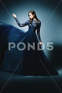 A full length portrait of a beautiful brunette lady. Evening dress. Fashion, Stock Photos