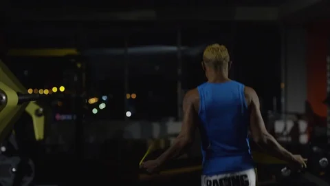 Full length portrait of a boxer jumping with skipping rope. Athletic, muscular Stock Footage