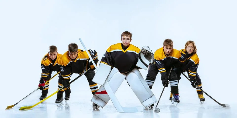 Full-length portrait of boys, children, professional hockey players isolated Stock Photos