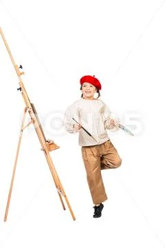 A full length portrait of a girl painting a picture. Creativity, artist. Stock Photos
