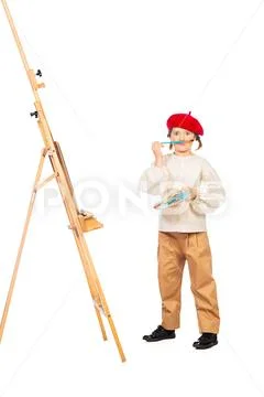 A full length portrait of a girl painting a picture. Creativity, artist. Stock Photos