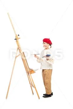 A full length portrait of a girl painting a picture. Creativity, artist. Stock Photos