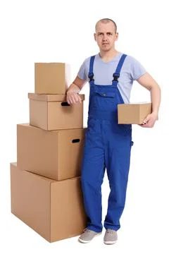 Full length portrait of loader man with heap of boxes isolated on white. 库存照片