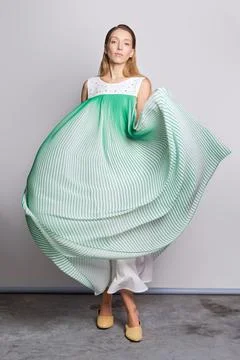 Full length portrait of model waving light airy sundress Foto stock