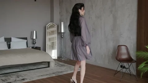 Full-length portrait of a woman. Young slender sexy woman with long dark hair Stock Footage 142596653