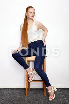 Full length portrait of young beautiful redhead beginner model woman in white Stock Photos