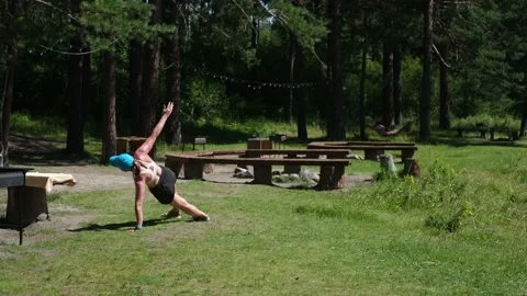 Full length shot of a slim active woman devoting time to exercising, doing a Stock Footage 234125460