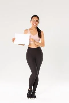 Full length of smiling good-looking asian brunette sportswoman, female athlete Fotos Stock