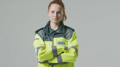 Full Length Studio Portrait Of Serious Young Female Paramedic Against Plain Stock Footage 152430380