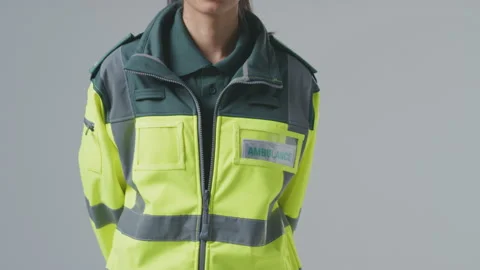 Full Length Studio Portrait Of Serious Young Female Paramedic Against Plain Stock Footage 152437099