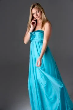 Full Length Studio Shot Of Young Woman In Blue Evening Dress Stock Photos