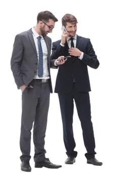 Full length . two businessmen using their smartphones Stock Photos