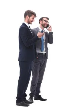 Full length . two businessmen using their smartphones Stock Photos