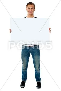 Full length view of man showing blank signboard Stock Photos