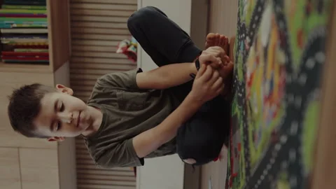 Full length view of small cute caucasian boy little child kid sitting on the Stock Footage 256966354