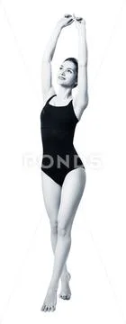 Full length woman posing in black one-piece swimsuit. Stock Photos