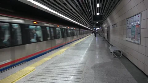 Full Marmaray train leaving empty platform Stock Footage 304358433