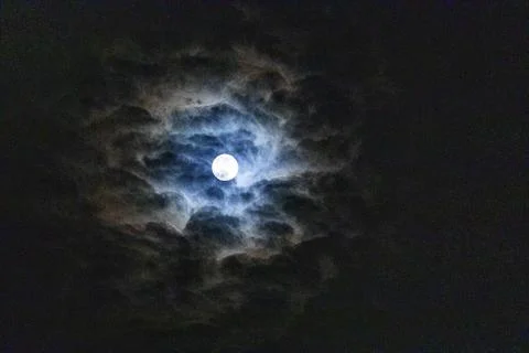 Full moon among clouds in the sky. Full moon, eclipse, Halloween Foto stock